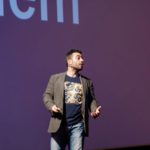 Jock Busuttil on stage giving talk “Digital Justice” at Product Management Festival 2015